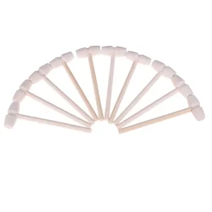 Mini wooden mallets detail view, natural wood small hammers for crafting, toys or tools.