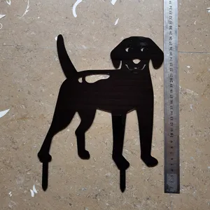 Detailed close-up shot of a black acrylic dog garden art stake displayed with a ruler.