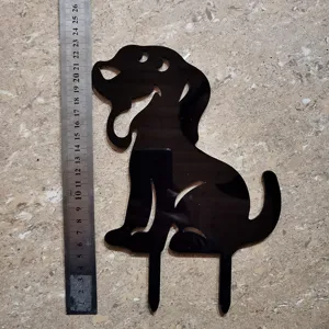 Acrylic black dog silhouette garden stake detail, decorative yard art lawn insert accessory.