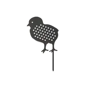 Black metal chick garden stake with cutout polka dots detail, perfect for outdoor lawn decor.
