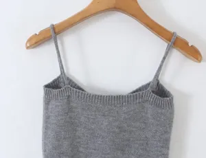 Detailed view of grey knit camisole, featuring fine soft fabric and elegant thin shoulder straps.
