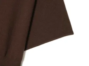 Brown knit top detail, elegant women's solid color sweater fabric texture, soft and comfortable.