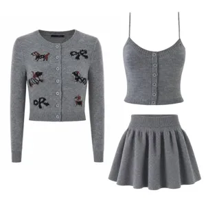 Detailed view of the grey knit cardigan set featuring cute dog patterns and buttons.