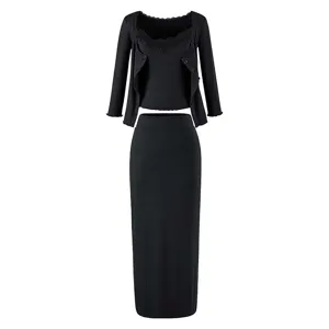 Detailed view of the black ribbed knit three-piece set, featuring lace trim and skirt.