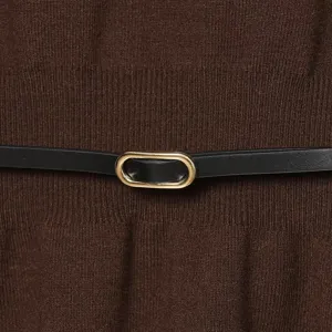 Elegant brown knit top featuring a chic black belt with a sleek gold oval buckle detail.