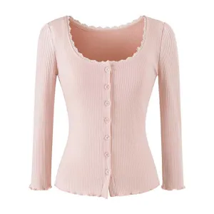 Stylish pink ribbed knit long sleeve button cardigan with elegant lace trim.