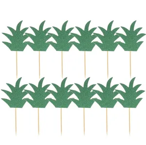 Green glitter pineapple leaf cake topper details showing the neat arrangement of paper party flags.