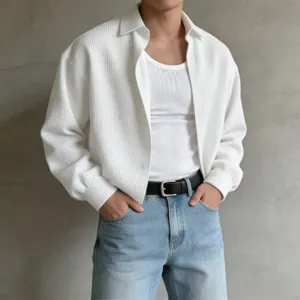 Men's textured long-sleeve button-up shirt detail, casual lapel design for layering style.