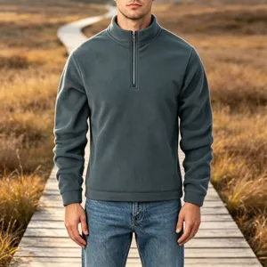Details of the men's half-zip fleece pullover featuring a stand collar and soft cozy texture.