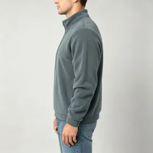 Side view detail of men's half zip fleece pullover in solid grey, stand collar design.