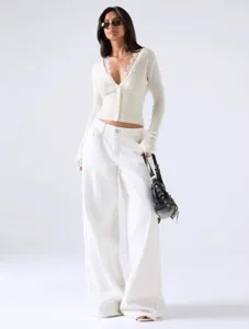 Women's V-neck lace patchwork knitted cardigan top, stylish autumn winter apparel detail.