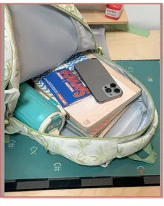 Detailed view of green bamboo print casual backpack showing spacious interior capacity.