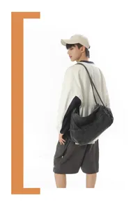 Casual denim shoulder bag for men, stylish vintage slouchy hobo crossbody travel bag.