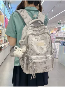Casual college style printed backpack with large capacity and cute pendant for daily use.