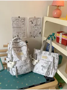 Leaf print student casual backpack and tote bag set with cute plush pendant and large capacity.