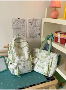 Chic bamboo print backpack and tote bag set with cute bear pendant, stylish and spacious daily use.