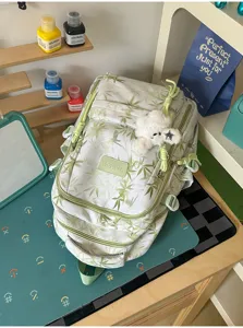 Stylish green bamboo print canvas backpack for college students, large capacity casual daypack.