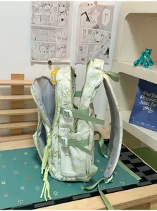 Green bamboo print backpack for students, large capacity casual daypack with multiple compartments.