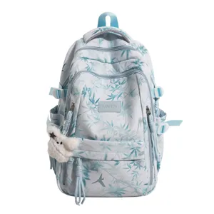 Stylish printed backpack for women, large capacity casual daypack with cute charm.
