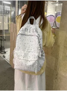Detail shot of a Korean ins-style star print backpack, stylish travel and school bookbag for women.