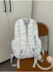 Detail view of a cute Korean style star pattern casual backpack in light blue and white.