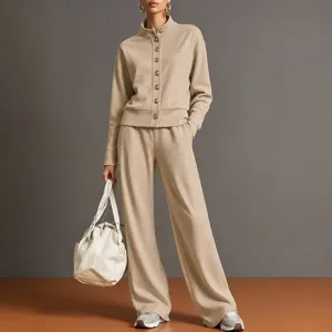 Detail shot of khaki stand-collar cardigan sweatshirt and wide-leg trousers outfit.