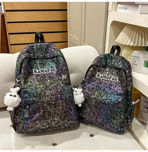 Trendy splatter pattern school backpack set with cute plush pendant for daily casual use.