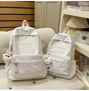 Korean ins style holographic white school backpack set with cute plush pendant for daily commute.