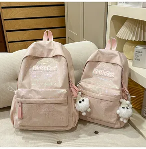 Pink holographic school backpack set with cute plush pendant for daily commute style