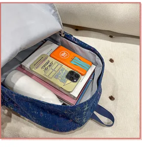 Korean style canvas backpack with spacious capacity and trendy splash ink design for daily use.