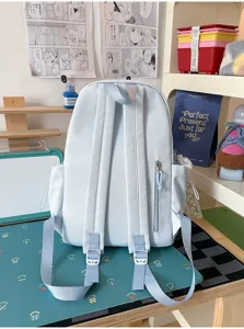 Ins style cute student backpack, light blue school bag with multiple pockets for daily travel use.