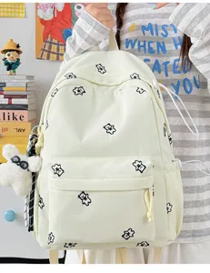 Cute small backpack for women, light yellow canvas school bag with sweet bear embroidery.
