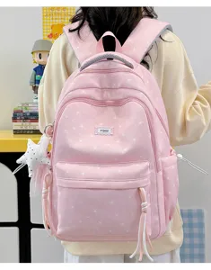 Pink cute star print backpack for school girls, casual aesthetic school bag with pockets.