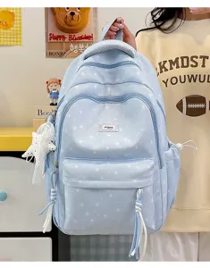 Light blue cute star print backpack detail view, casual school bag with multiple pockets.