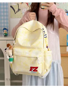 Yellow tie-dye canvas backpack for daily use, stylish school rucksack and travel bag for men
