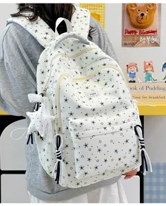 White star print backpack casual school bag with cute star pendant and front pocket design.