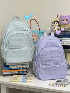 Detail view of casual nylon backpack, compact everyday daypack, lightweight campus bookbag.