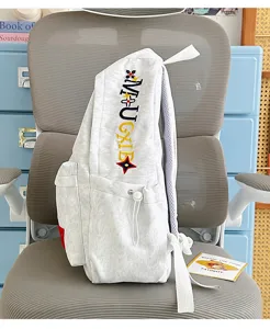 Vintage grey canvas backpack with embroidered letters, stylish lightweight travel school bag.
