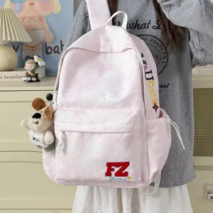 Pink tie-dye canvas backpack for women and men, cute school bag with puppy plush pendant.