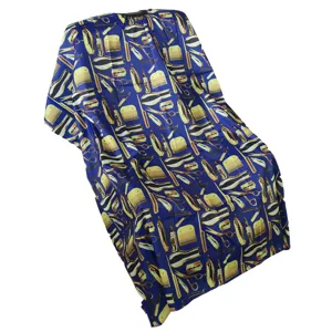 Professional waterproof salon haircut cape with hairdressing tools print detail view.