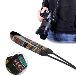 Close-up detail of bohemian style woven camera strap texture and DSLR usage scene display.