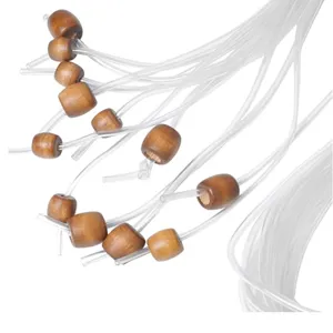 Detailed shot of Tunisian crochet hook flexible cable extension with smooth natural wooden beads.