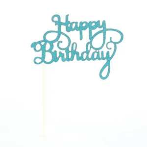 Blue glitter Happy Birthday cake topper detail showing sparkling finish and wooden stick.