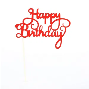 Red glitter Happy Birthday cake topper closeup detail view for birthday party decoration.