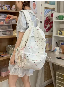 Cute sweet Japanese style polka dot backpack with hearts and bows for women and students.
