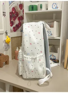 Cute Japanese style white backpack with black dots and pink hearts for school and daily use.