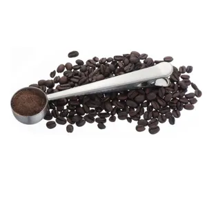 Stainless steel coffee scoop with bag clip, durable metal measuring spoon for kitchen use.