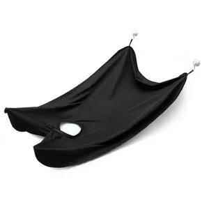 Details of the black beard trimming apron cape with suction cups for easy cleaning.