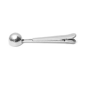 Stainless steel coffee scoop detail view, multi-functional spoon with sealing clip for kitchen use.