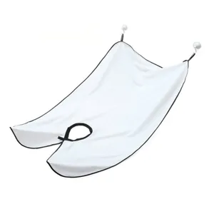 Detail view of white barber shaving cape with suction cups for beard and hair collection.